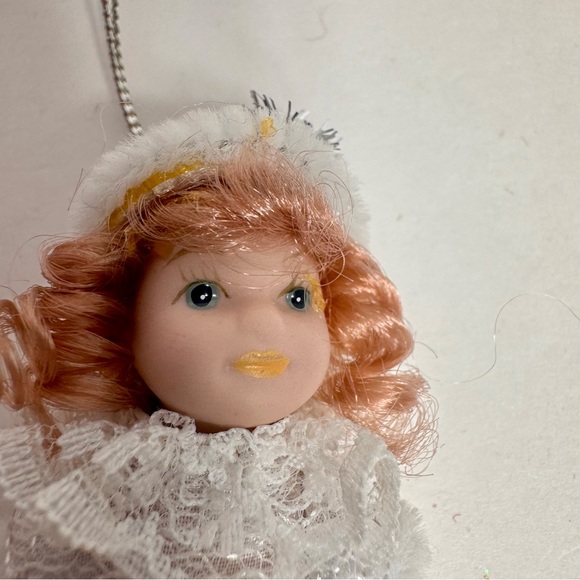 NWT. 7 porcelain doll ornaments. 5 of little girl and 2 of baby. - Picture 7 of 14